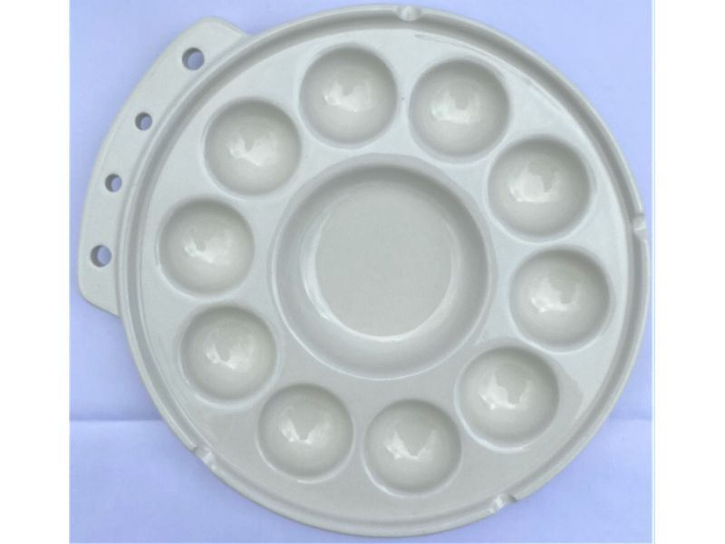19 cm round ceramic palette, with 11 round grooves and brush rest